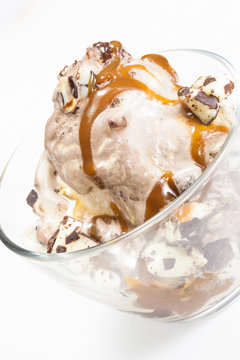 Ice Cream Sundae Topped With Caramel Syrup And Chocolate Truffle