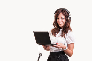 Studio shot,of an businesswoman working at the laptop and listen