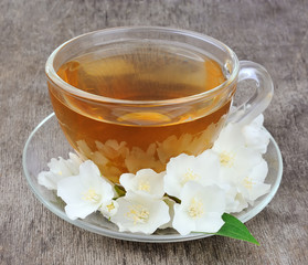 Tea with fresh jasmine flowers
