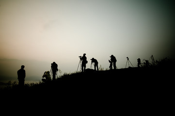 Fototapeta na wymiar Silhouette of photography on the cliff. Phu Chee Fah Thailand.