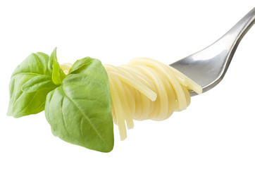 fork with spaghetti  and basil on white