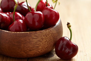 fresh cherries on wooden table