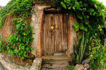 Antique wood door is closed.