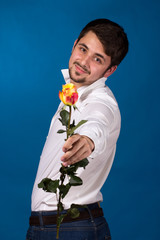 young man giving a red rose