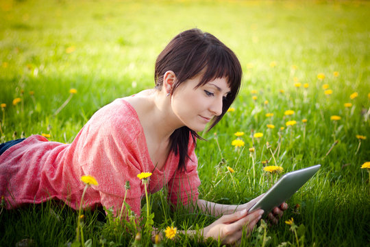 woman using tablet outdoor
