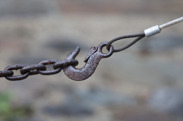 Metal hook hanging on chain