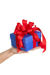 blue gift box with red ribbon in woman hand