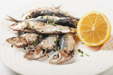 Grilled sardine fish with lemon and herbs