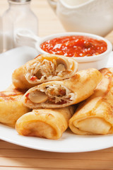 Egg rolls with tomato sauce
