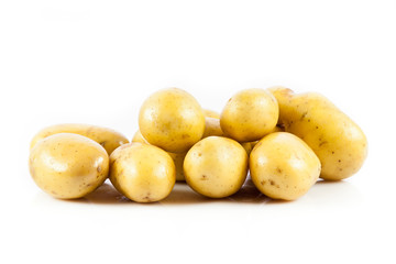 Fresh potatoes on a white background.