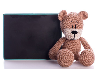 brown teddy bear student with blackboard