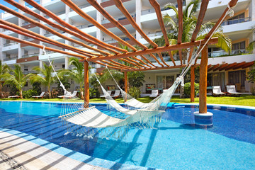 Swimming pool and hammock.