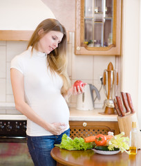 pregnant woman with apple