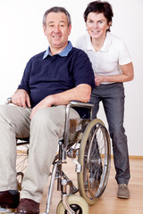 Fototapeta na wymiar woman helps a wheelchair user in the office