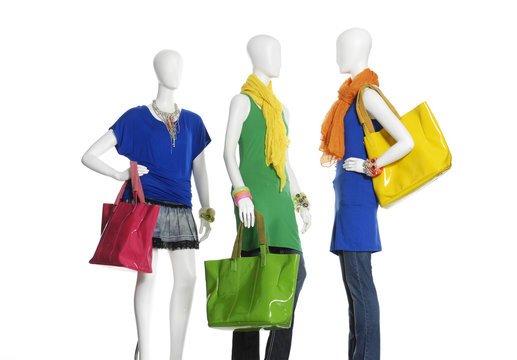 Three female clothing ,scarf ,bag on three mannequin
