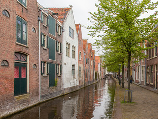 Fototapeta na wymiar Traditional dutch buildings on canal in Alkmaar