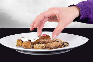 Hand reaching for cake plate