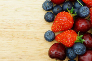 Fruit border on Wooden Background