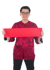 Happy Chinese male in cheongsam hands holding red packets / ang