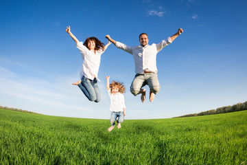 Happy family jumping