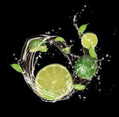 Fresh fruit in water splash, isolated on black background