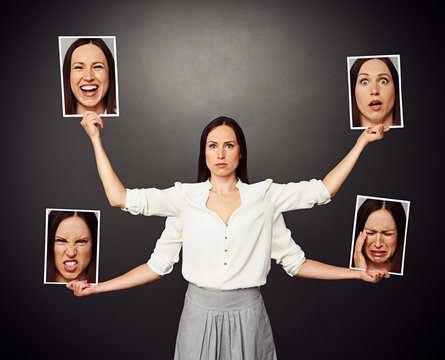 woman holding pictures with different mood