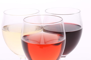 three glasses with white, rose and red wine