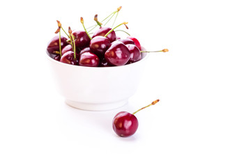 Sweet fresh cherry in a bowl isolated