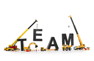 Team building: Machines building team-word.