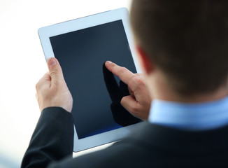 Businessman holding digital tablet