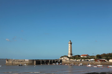 Lighthouse by a small port