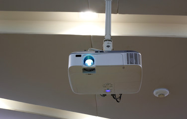 Overhead projector under the ceiling in boardroom