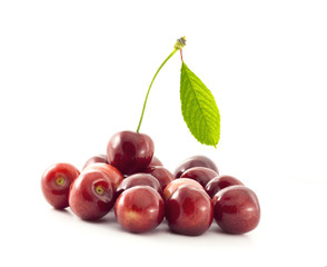 Group of cherries with a leaf