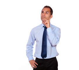 Attractive pensive adult man looking up