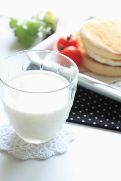 glass of milk and english muffin for healthy breakfast image