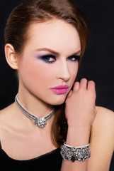 glamour girl with bright make-up-and bracelet , Jewelry on black