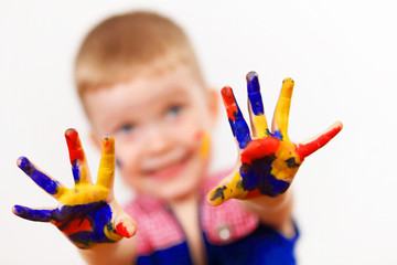 happy child with paint on the hands