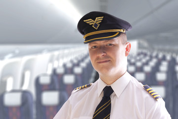 The pilot in the airplane cabin waiting for passengers