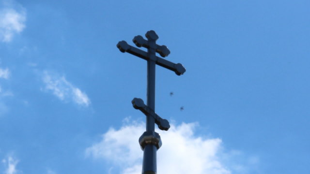 Russian Orthodox Church. Dome and cross on a background of blue 