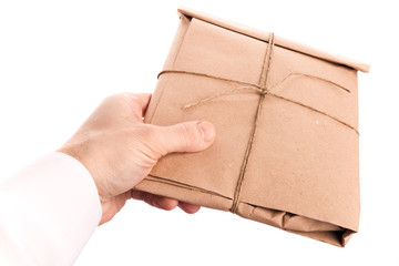 Male hand delivers envelope tied with a rope isolated