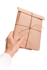 Male hand holds envelope tied with a rope isolated on white
