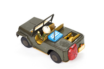 Vintage military toy car on white background