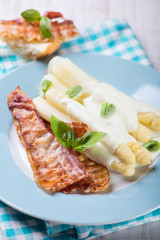 White asparagus served with bacon