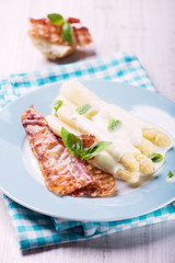 White asparagus served with bacon