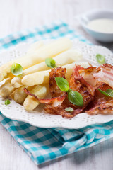 White asparagus served with bacon