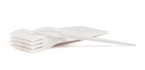 Disposable white plastic forks isolated