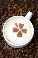 cup of cappuccino with cinnamon pattern