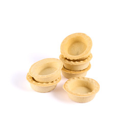 Pile of empty tartlets isolated