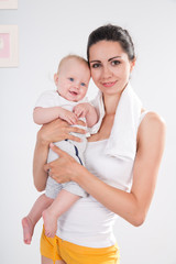 Mother after fitness exercises with her baby