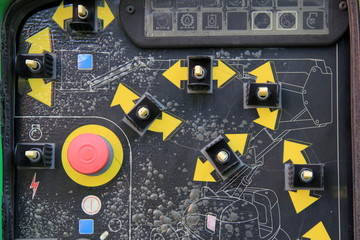 Instruction board with bright yellow arrows on machinery